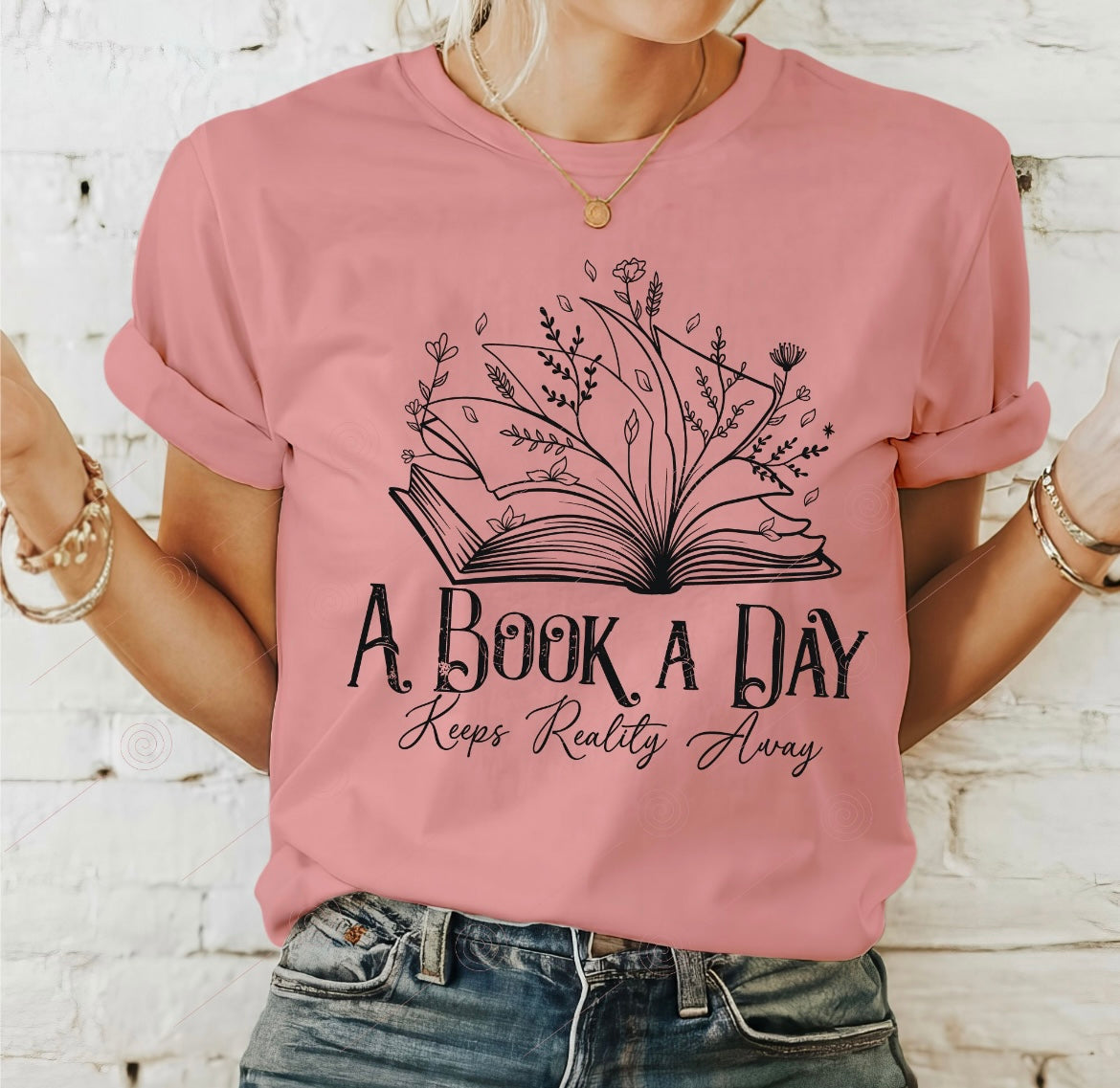 A book a day keeps reality away graphic shirt