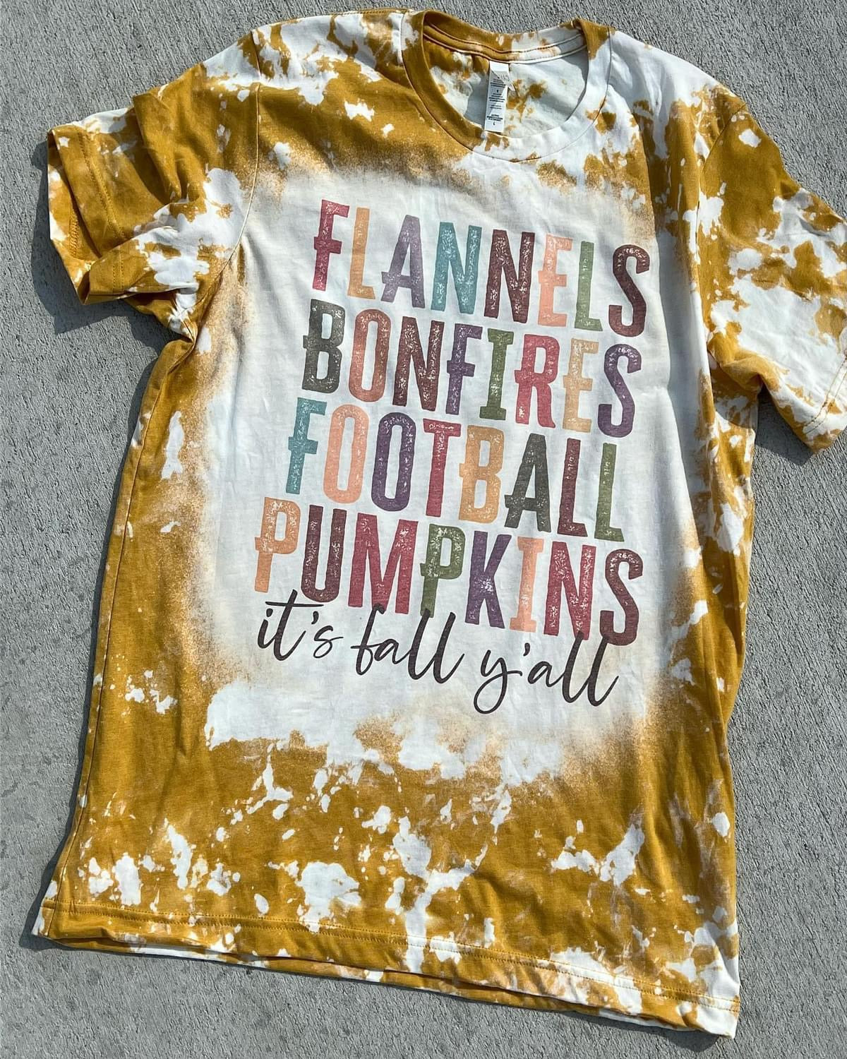 Flannels bonfires football pumpkins it’s fall y’all 
graphic shirt